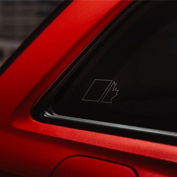 Close-up on the Maple Leaf Edition window decal on the rear window of an Audi SQ7.
