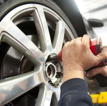 Service technician servicing air filter.