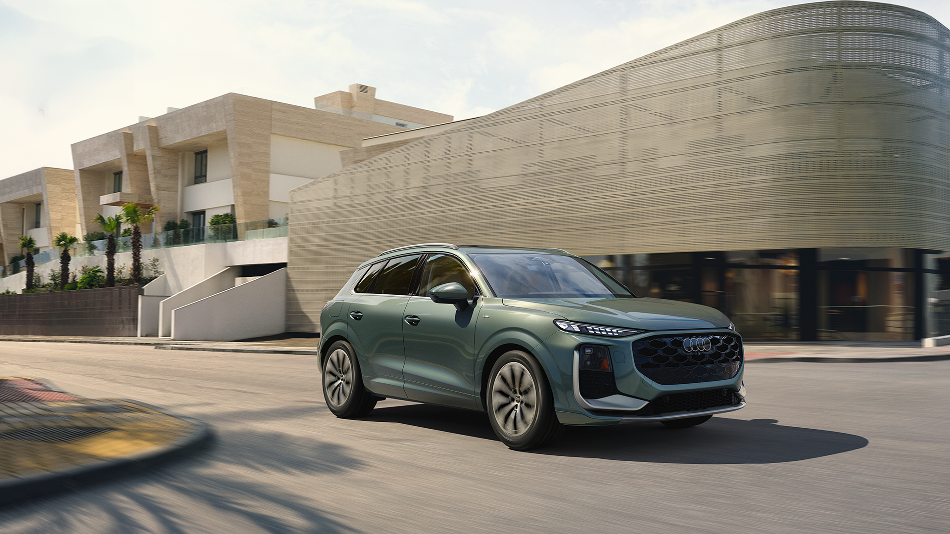 Audi 2025 Audi Q6 e-tron left profile driving.