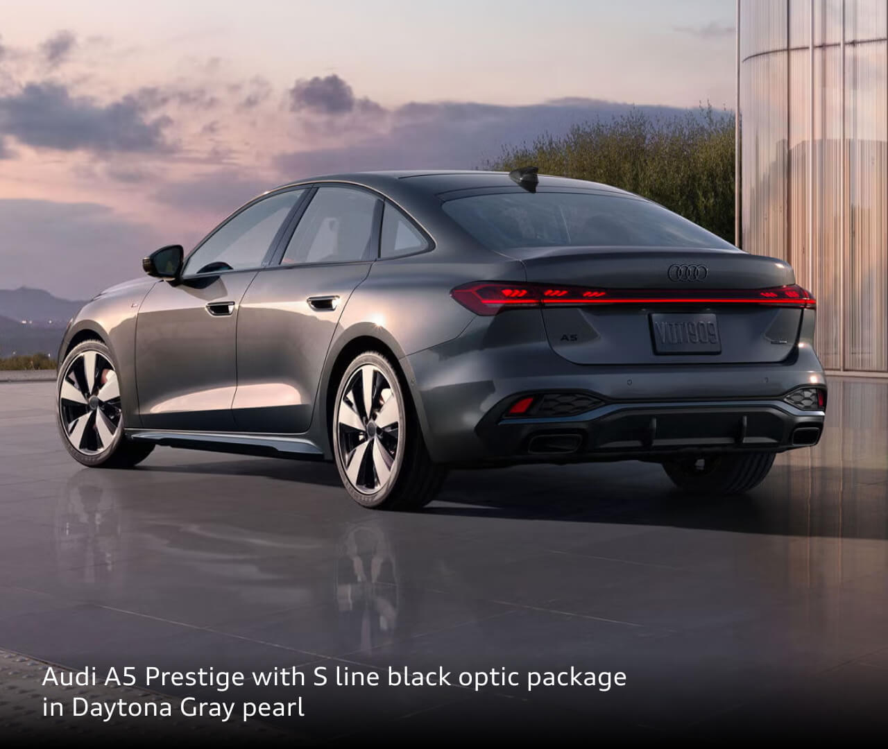 Rear three-quarter view of a 2026 Audi A5 Prestige in Daytona Gray