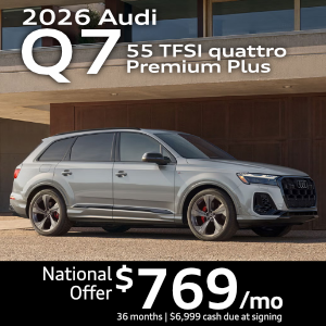 Side view of an Audi Q7 driving.