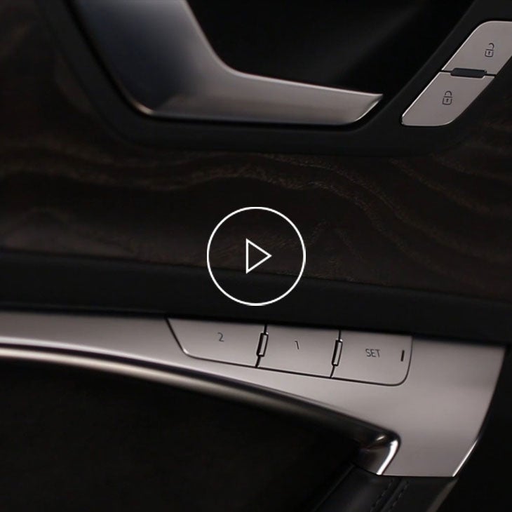 Close-up of the seat memory function buttons in an Audi vehicle. 