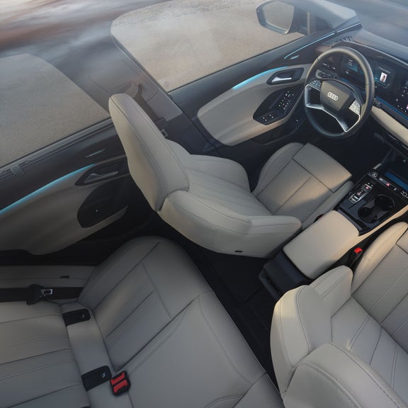 Wide-shot of the interior of the Audi Q6 e-tron, showing interior lighting features.