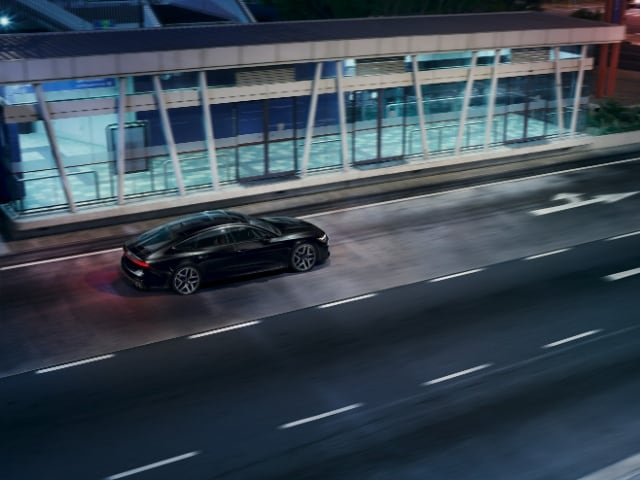 2025 Audi S7 parked under bright city lights
