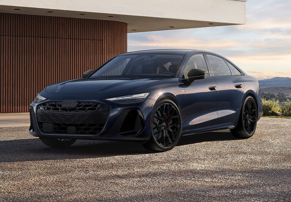 Left profile view of an Audi Q7 e-tron on the highway