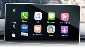 Close-up on the MMI display on an Audi vehicle, showing the navigation services.