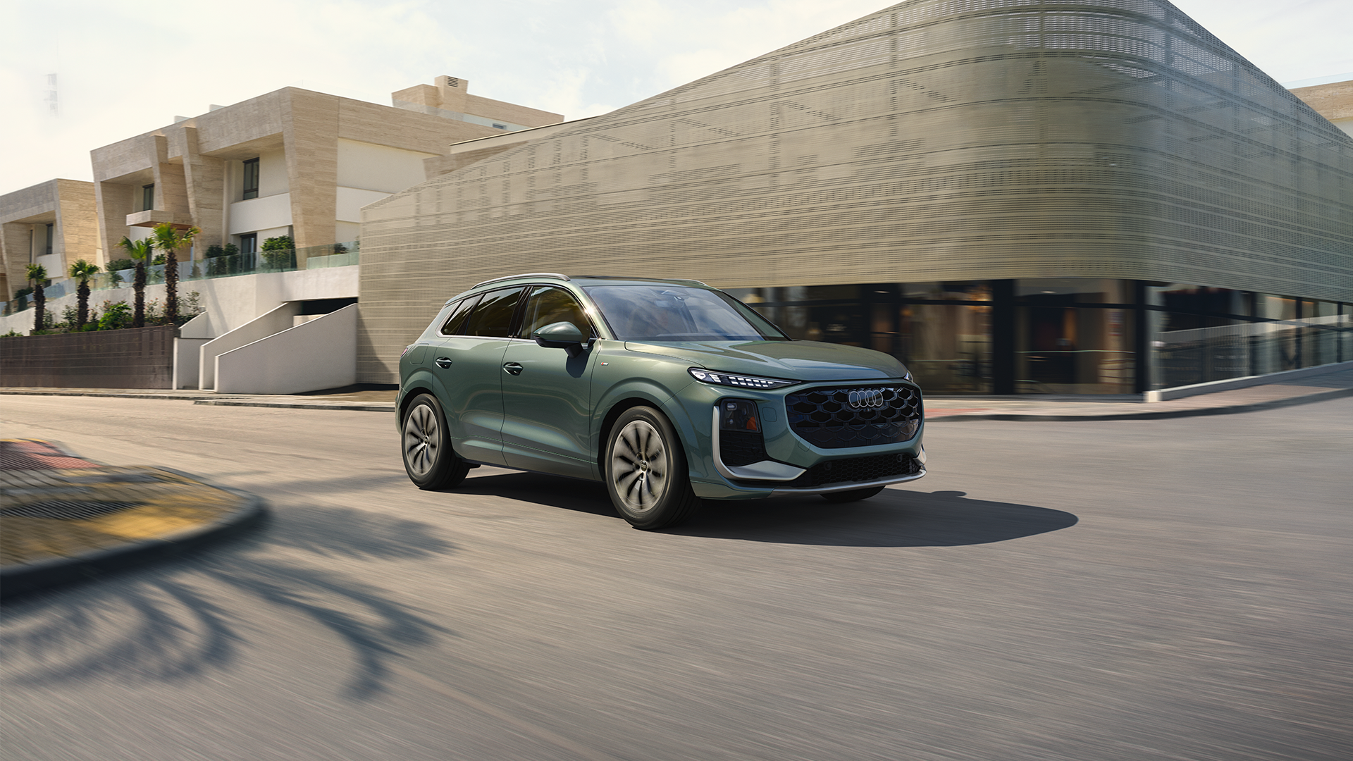 Audi 2025 Audi Q6 e-tron left profile driving.