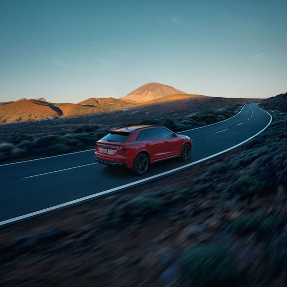 Three-quarter rear view of the Audi RS Q8 in motion.