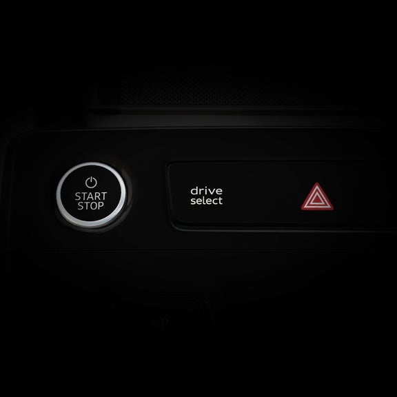 Close-up on the Audi drive select button on the Audi S6 e-tron.