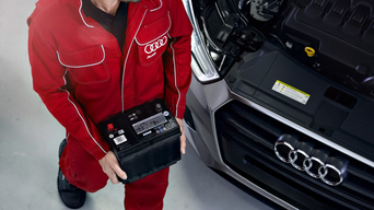 Service technicians servicing vehicle.