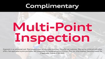 Service technician servicing vehicle. 