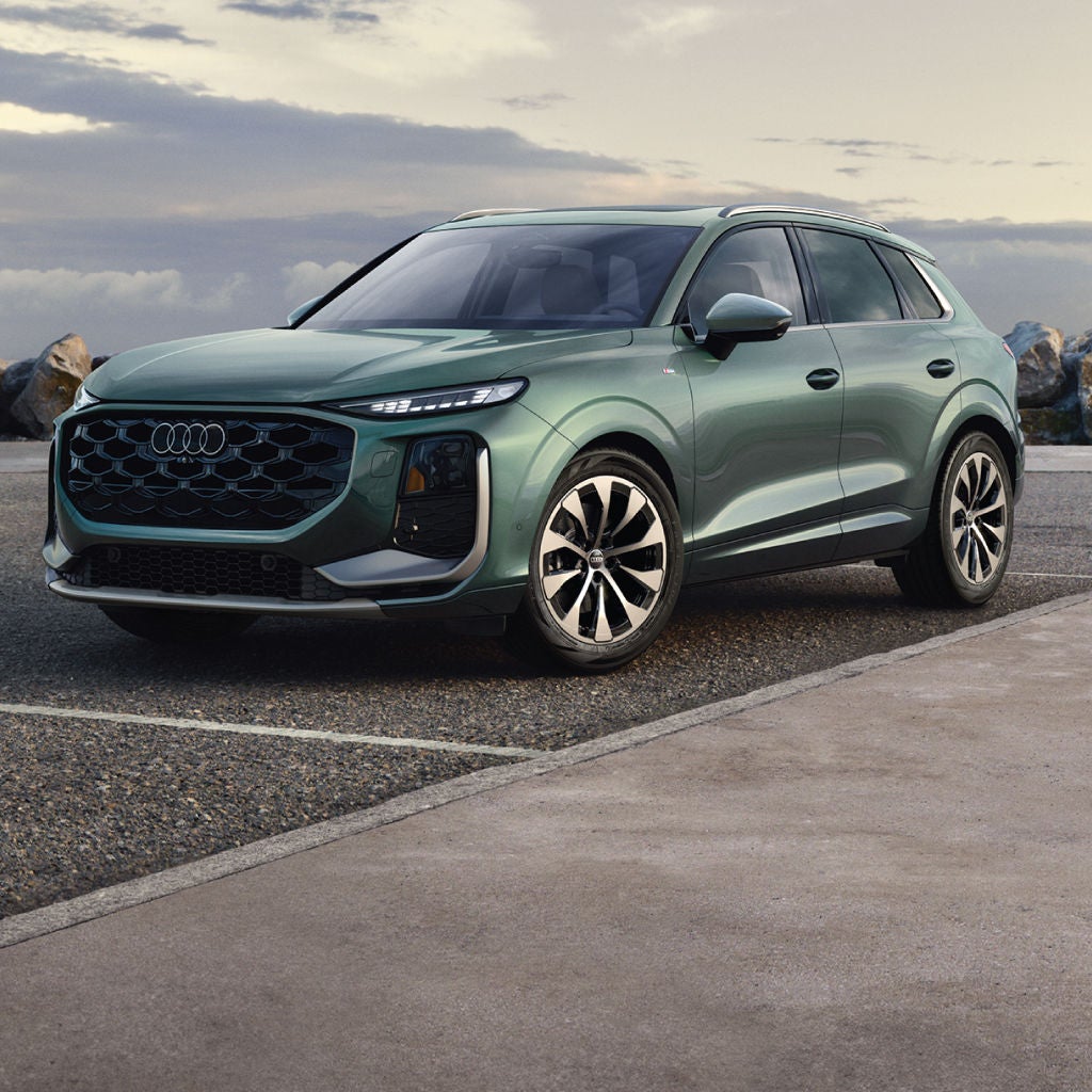 Rear profile view of an Audi Q5 parked.