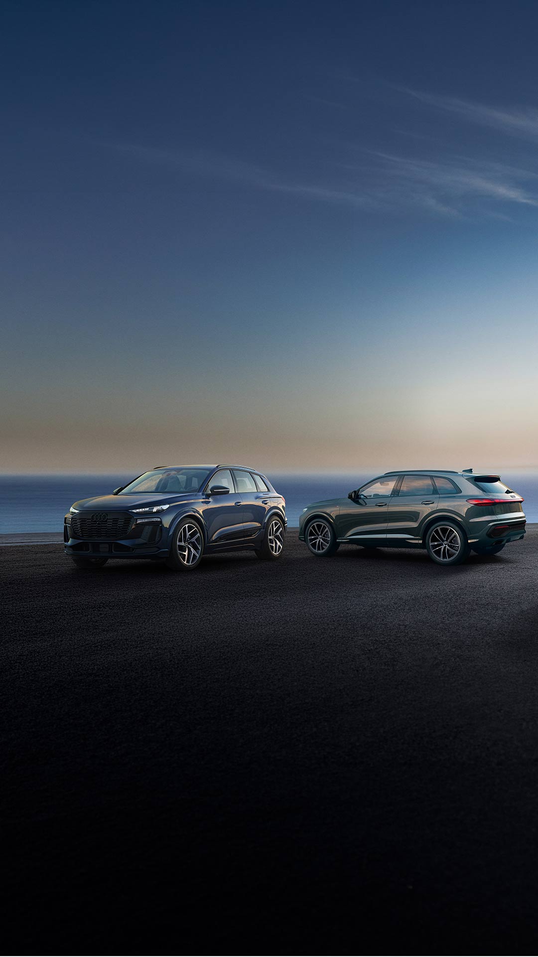 Image of the Audi Q3, Q5, and Q6 e-tron parked. 