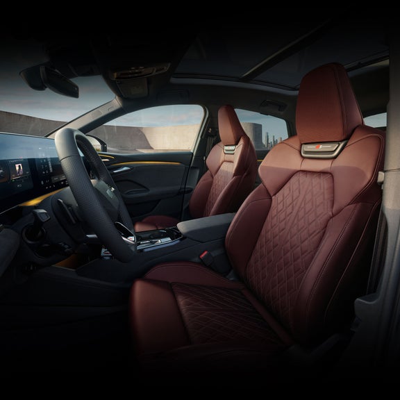 Interior view of the Audi SQ6 Sportback e-tron, showing the driver and passenger seats.