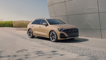 Elevated three-quarter front profile of the Audi Q8.