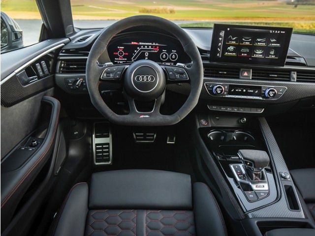 Audi RS5 cabin showing luxury materials and driver‑focused layout