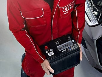 Service technician servicing air filter.