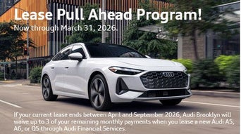 Side view of an Audi driving.