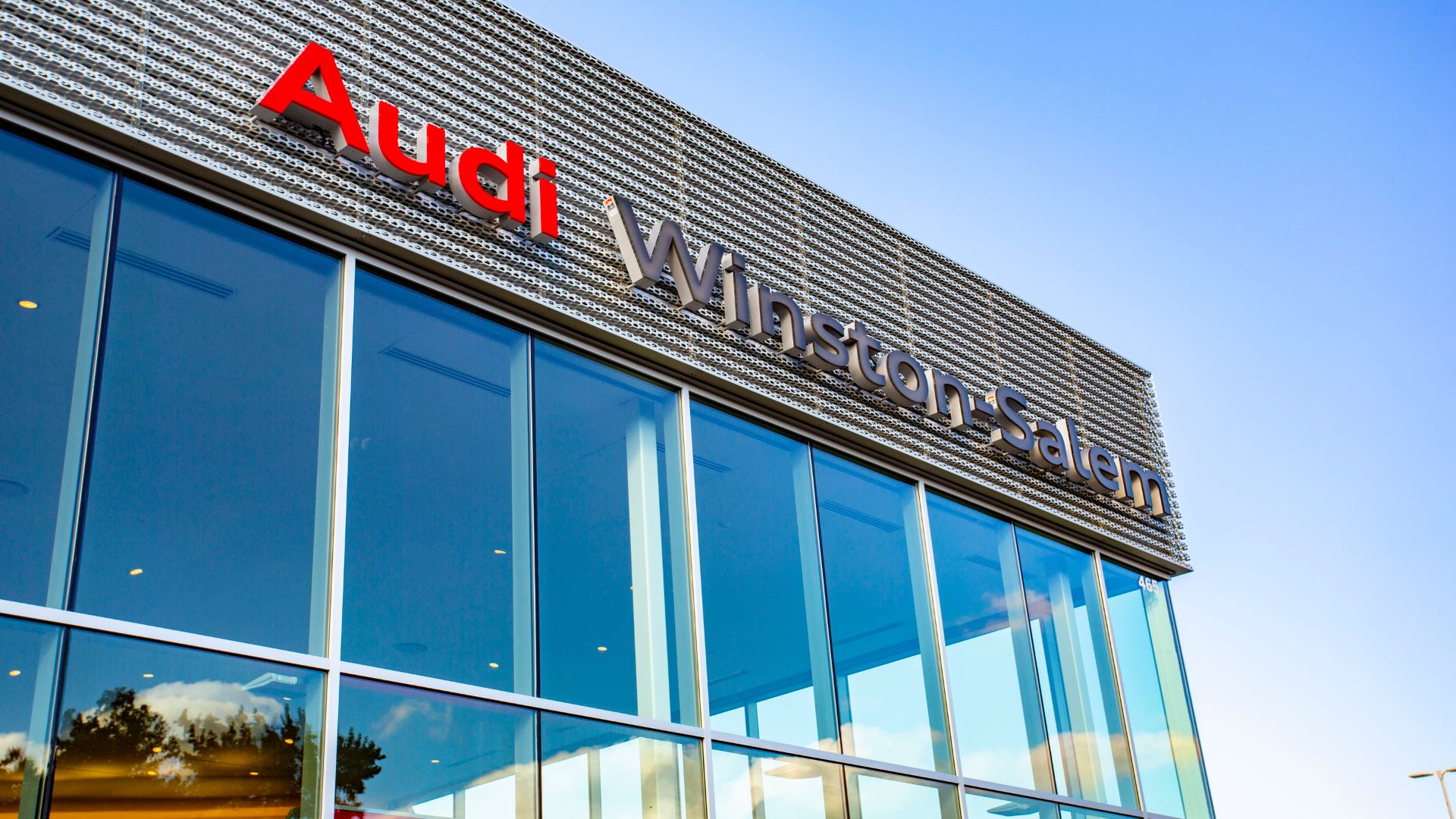 Audi Winston-Salem logo on the Audi Winston-Salem dealership building 