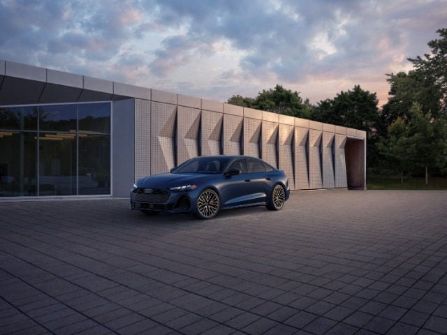 Audi S5 parked in a driveway far view