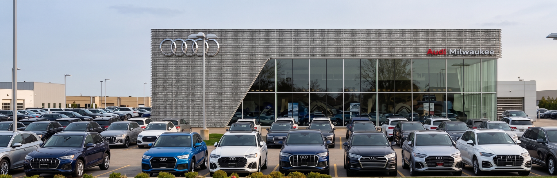 Audi Sale Specialist walking through the showroom with a couple.