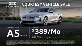 three quarter view of an Audi A5 parked.