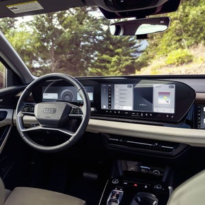 Close-up of the wraparound virtual cockpit in the Audi Q6 e-tron.