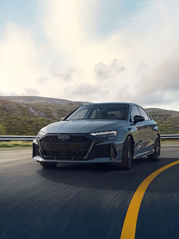 2025 Audi RS 3 front profile driving — five-cylinder character on the road