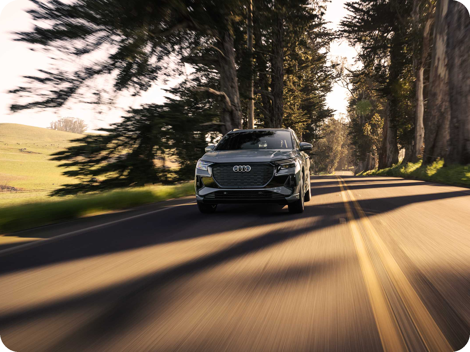 Audi Q4 e-tron — compact electric SUV in motion.