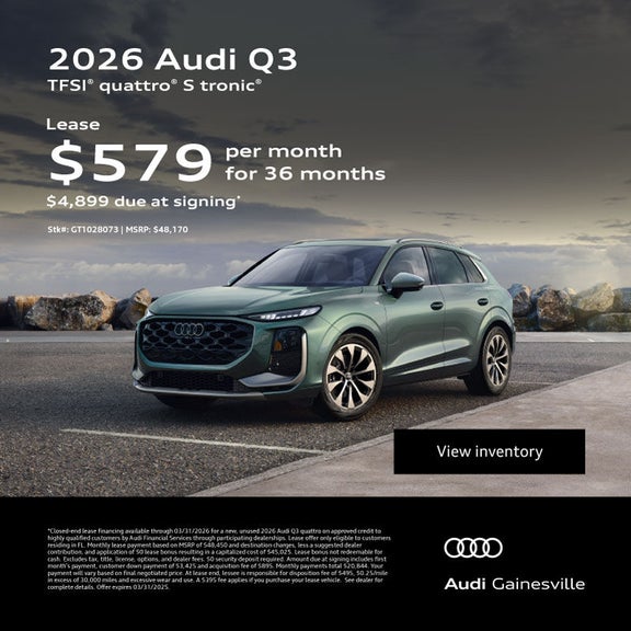 Side view of an Audi vehicle driving.