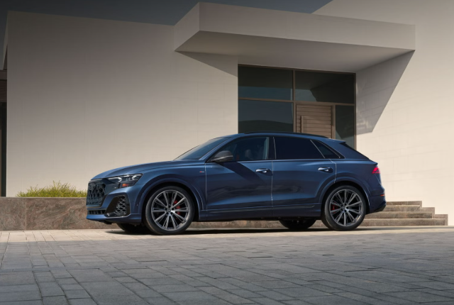 2026 Audi Q8 parked outside a modern architectural building