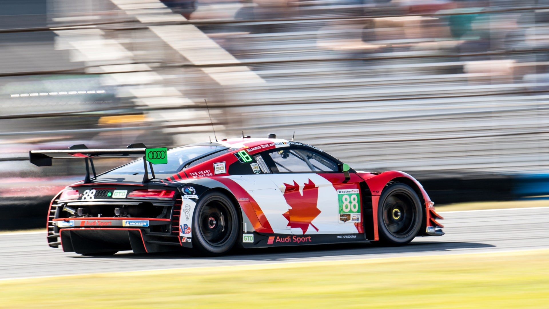 The Audi R8 LMS GT3 race car accelerating.