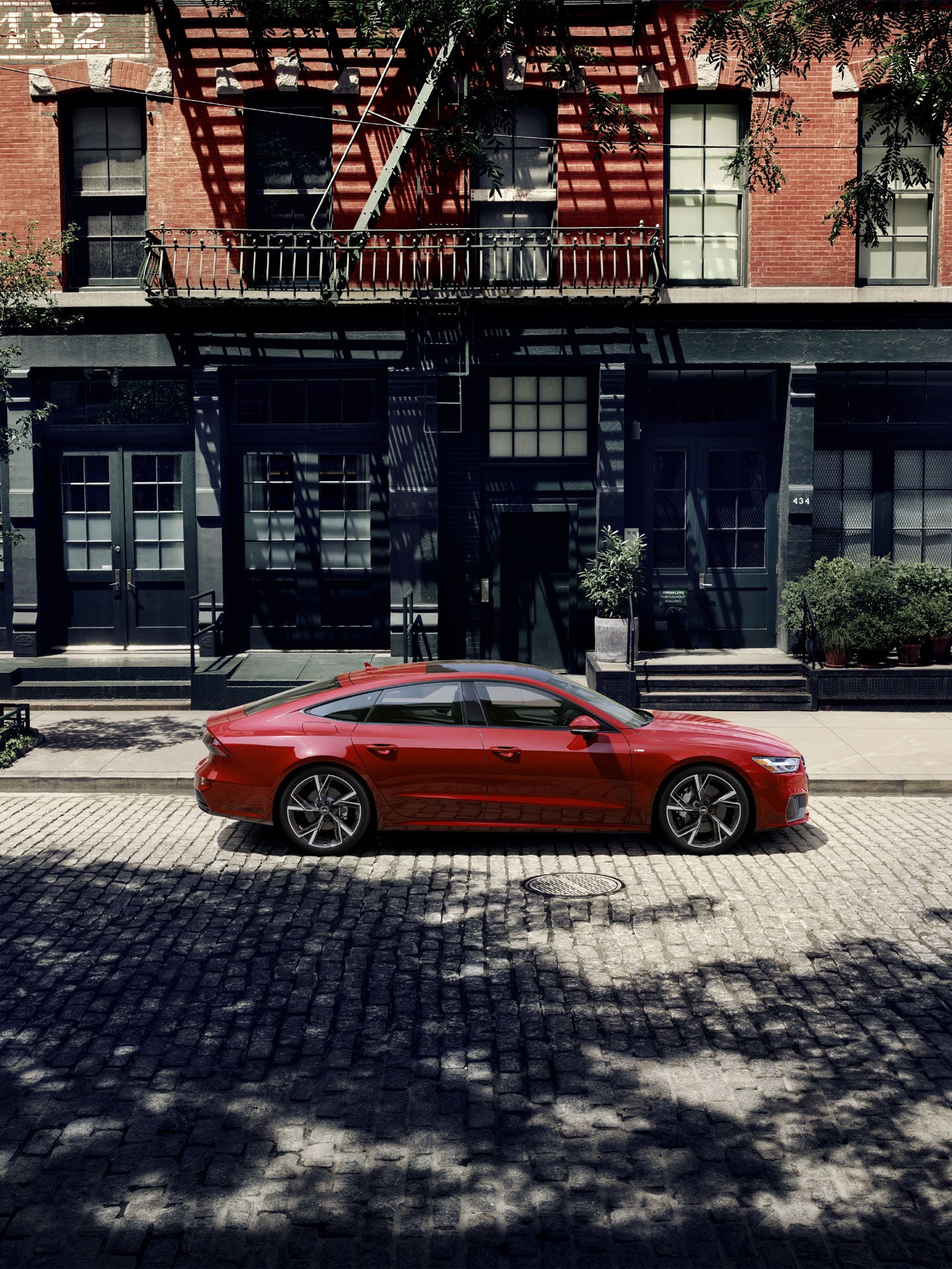 Side view of an Audi A7 in parked on a city street.