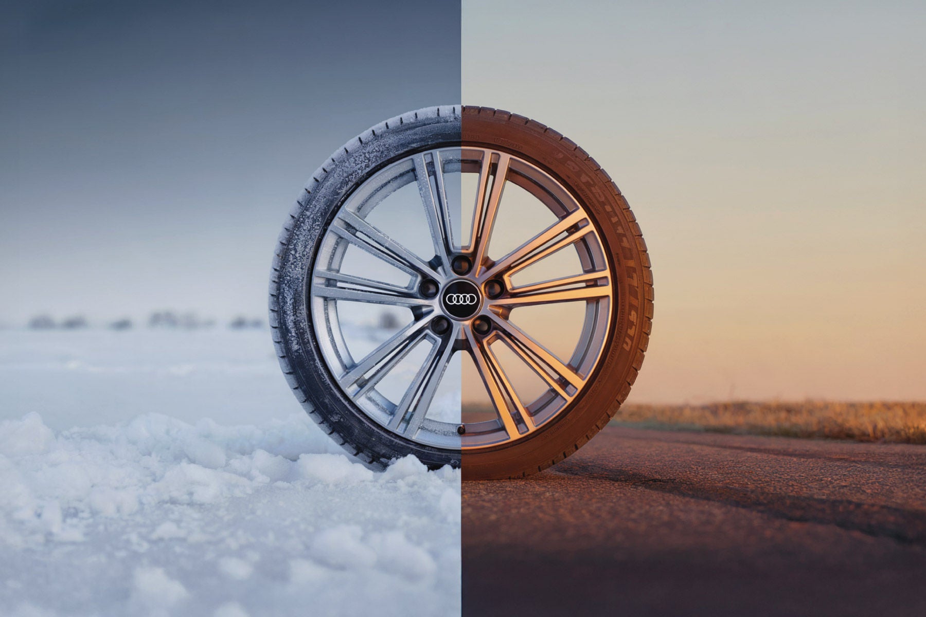 Close-up comparison of winter tires versus all-season tires on an Audi vehicle