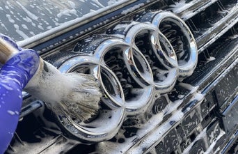 Service technician servicing vehicle.