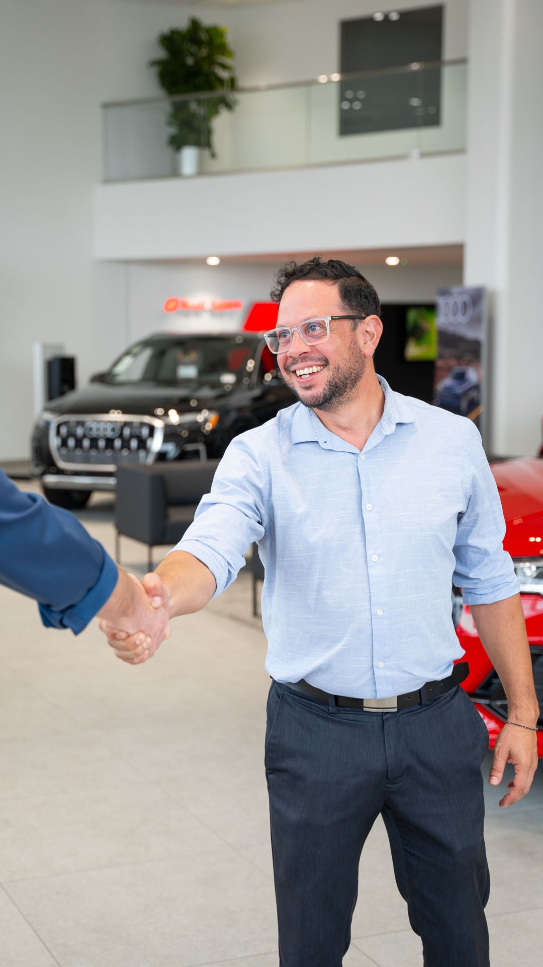 Shaking hands in the showroom.