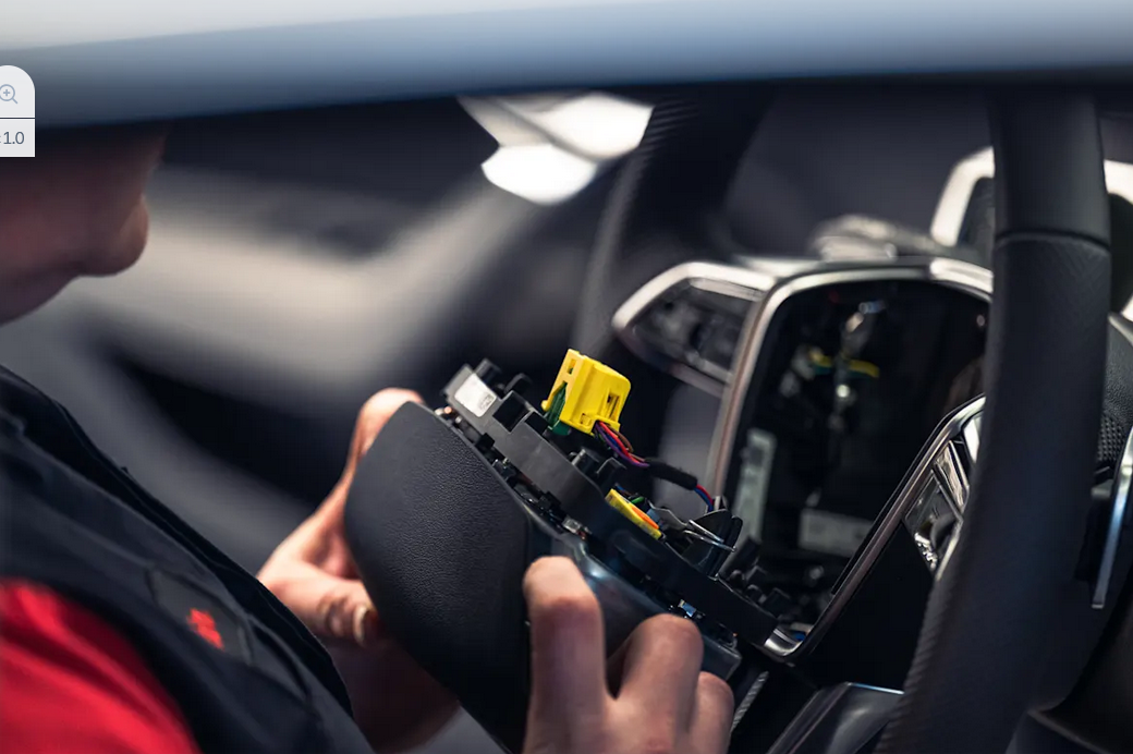 Audi service technician servicing vehicle