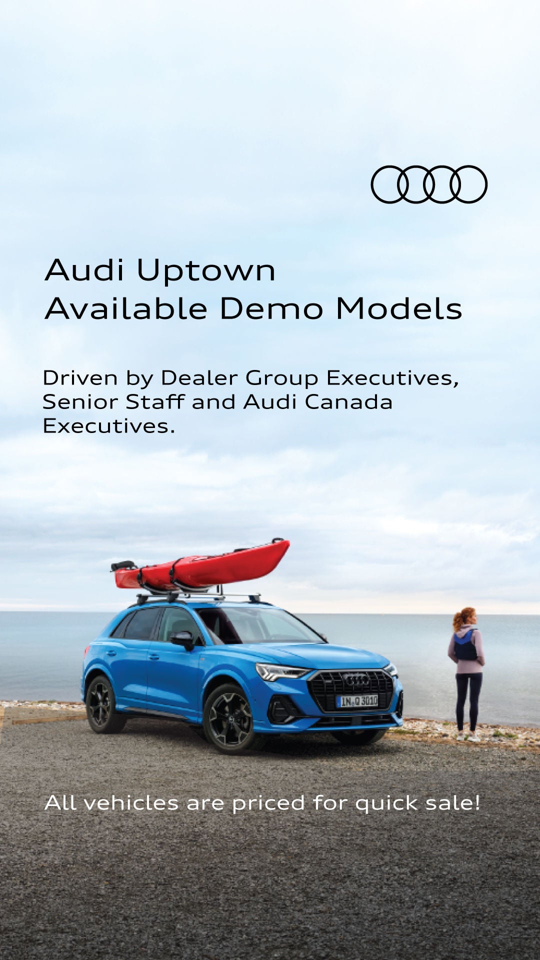 Audi Demo Sale Model Q3 SUV on a spring day with beautiful water in the background