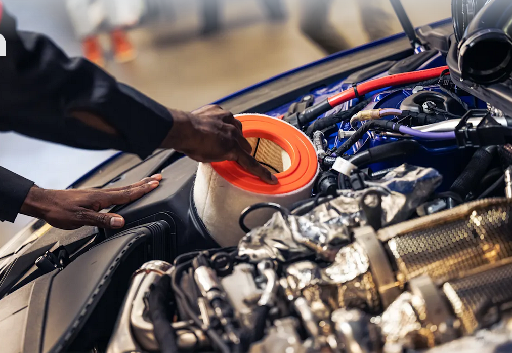 Audi service technician servicing vehicle