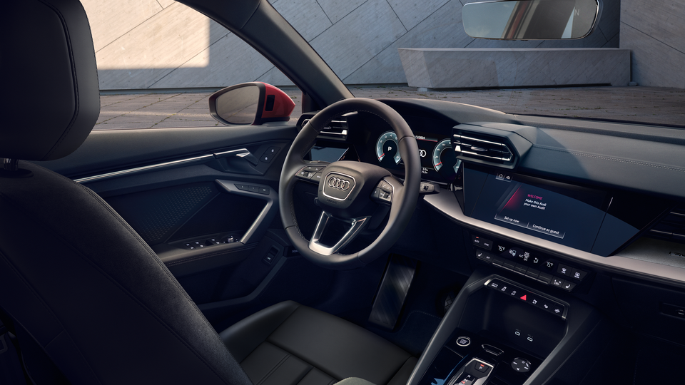 Inside of an Audi A3, showing the technology on the front dashboard.