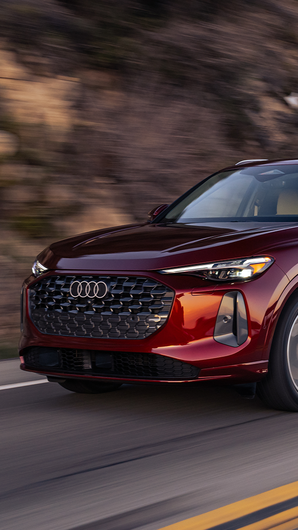 Audi 2025 Audi Q5 left profile driving.