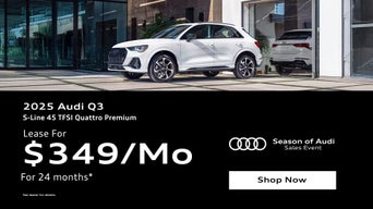 Three quarter view of an Audi Q3 parked.