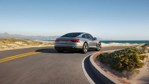 Three-quarter front view of the Audi RS e-tron accelerating. 