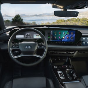 Close-up of the wraparound virtual cockpit in the Audi A6 e-tron.