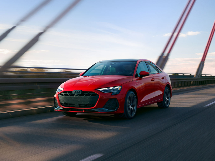 A new Audi model driving on a bridge