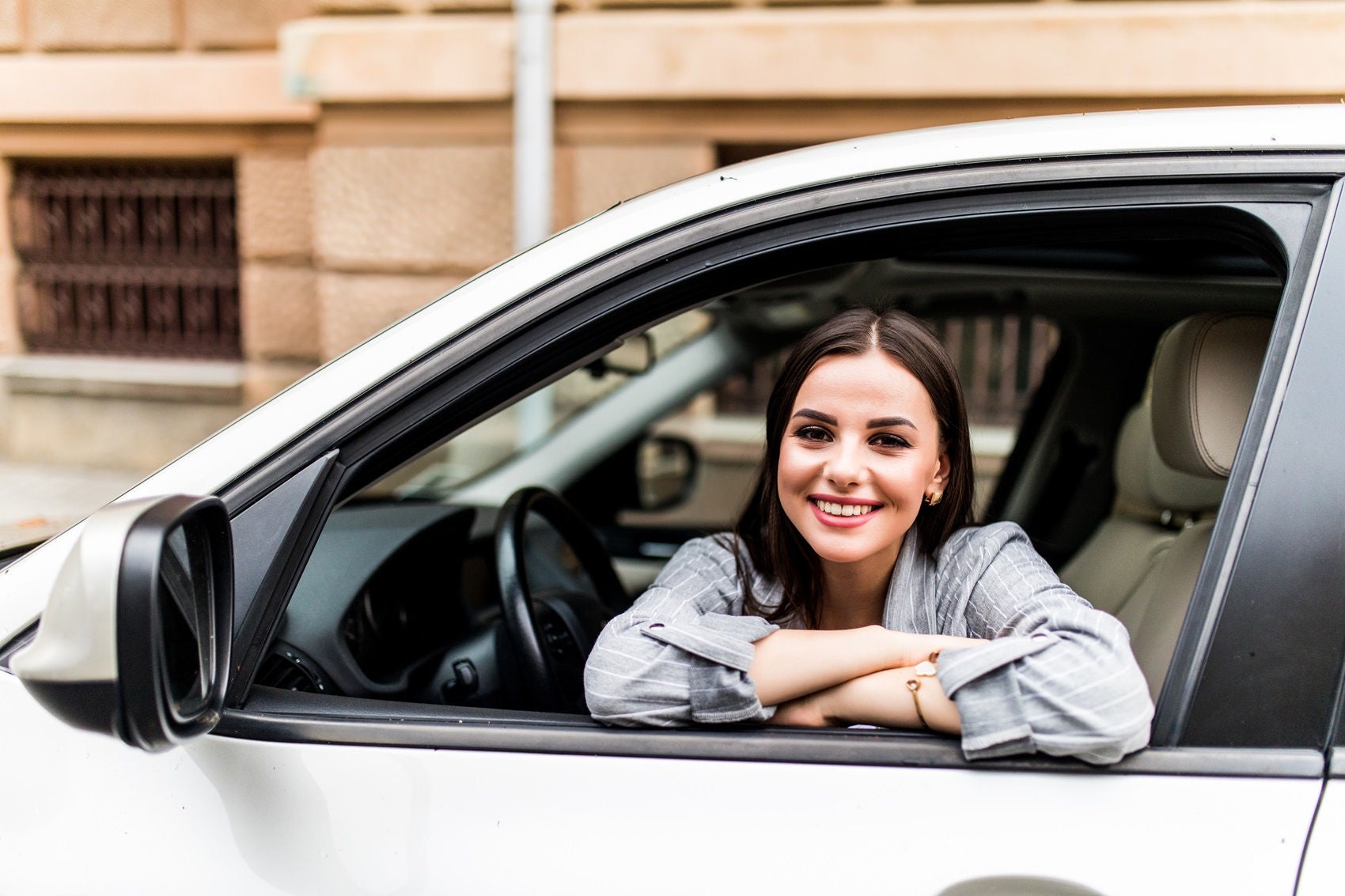woman smiling in car