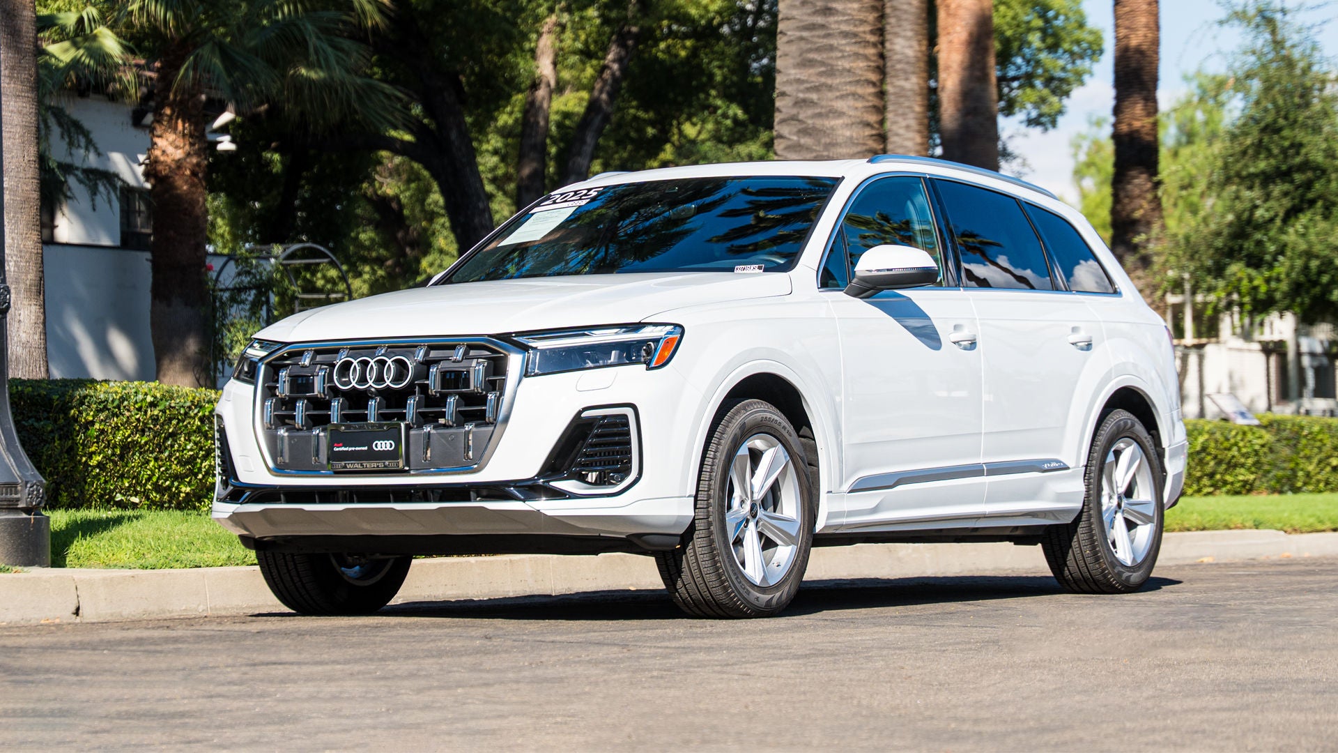 Three quarter view of a Pre-Owned Audi Q7 parked in downtown Ontario.