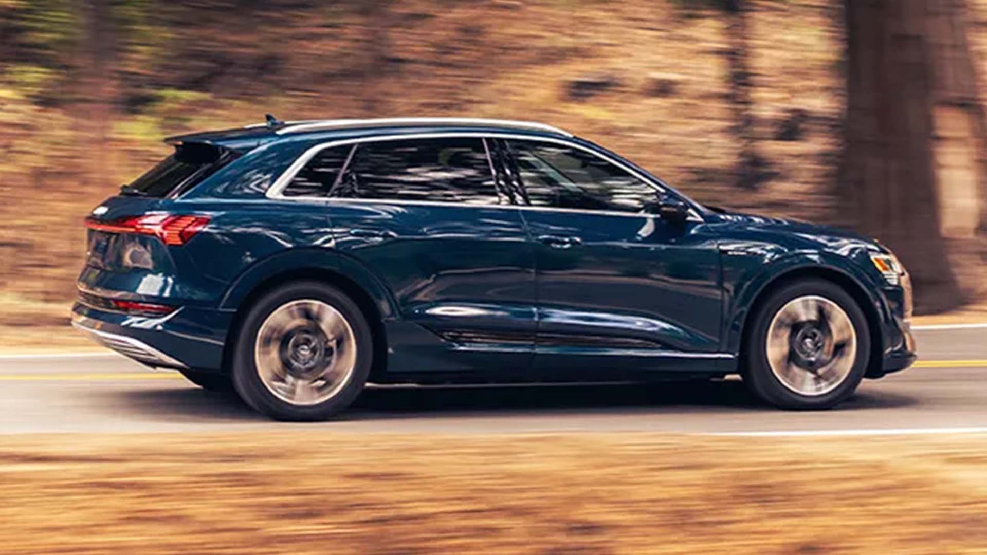 Right side profile view of an Audi accelerating.