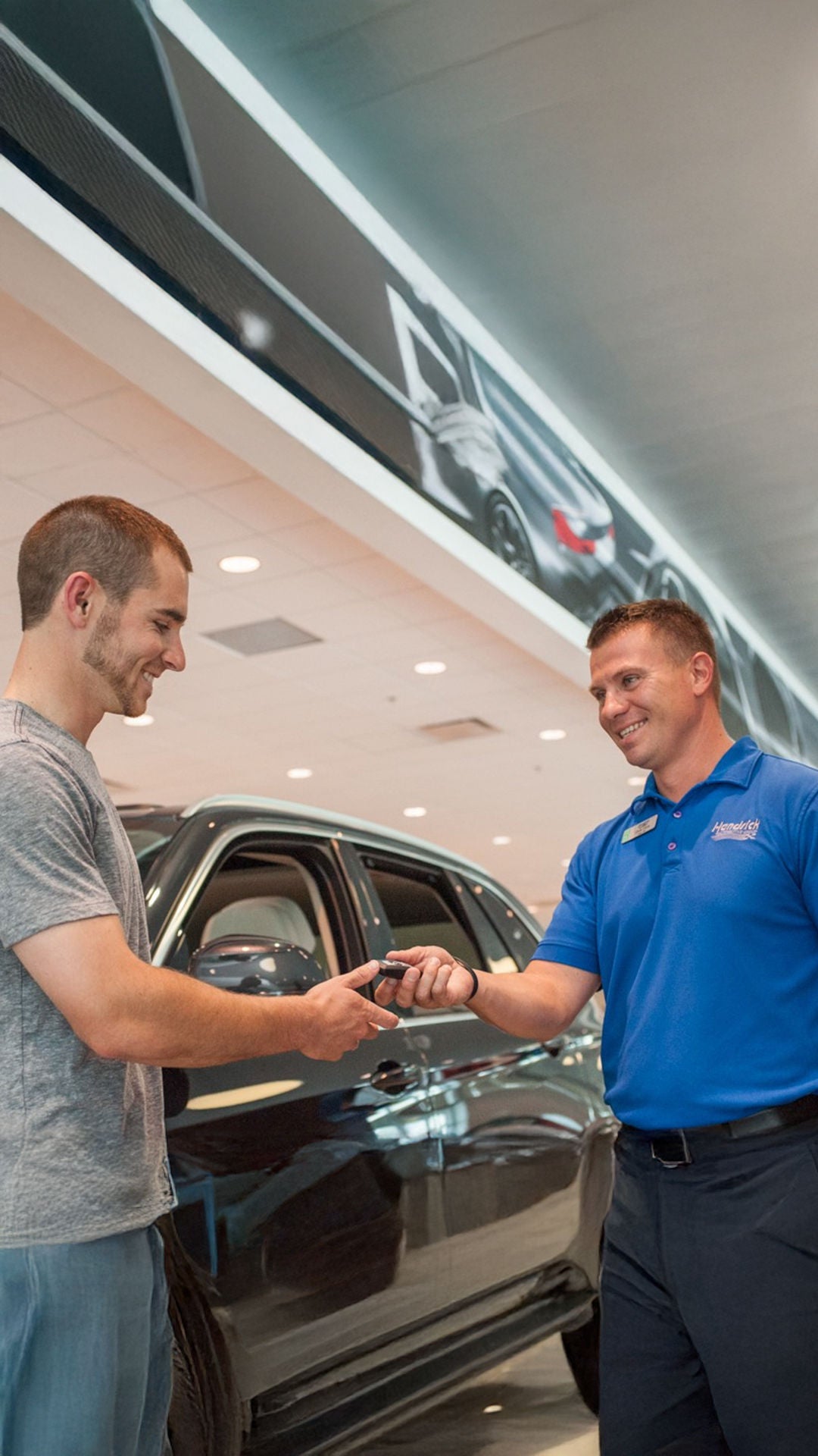 Audi South Austin representative shaking hands with a customer.
