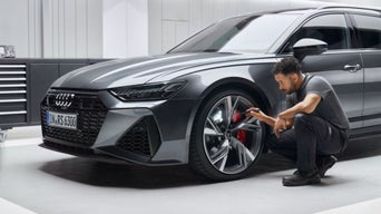Audi Technician serving tire at Audi garage
